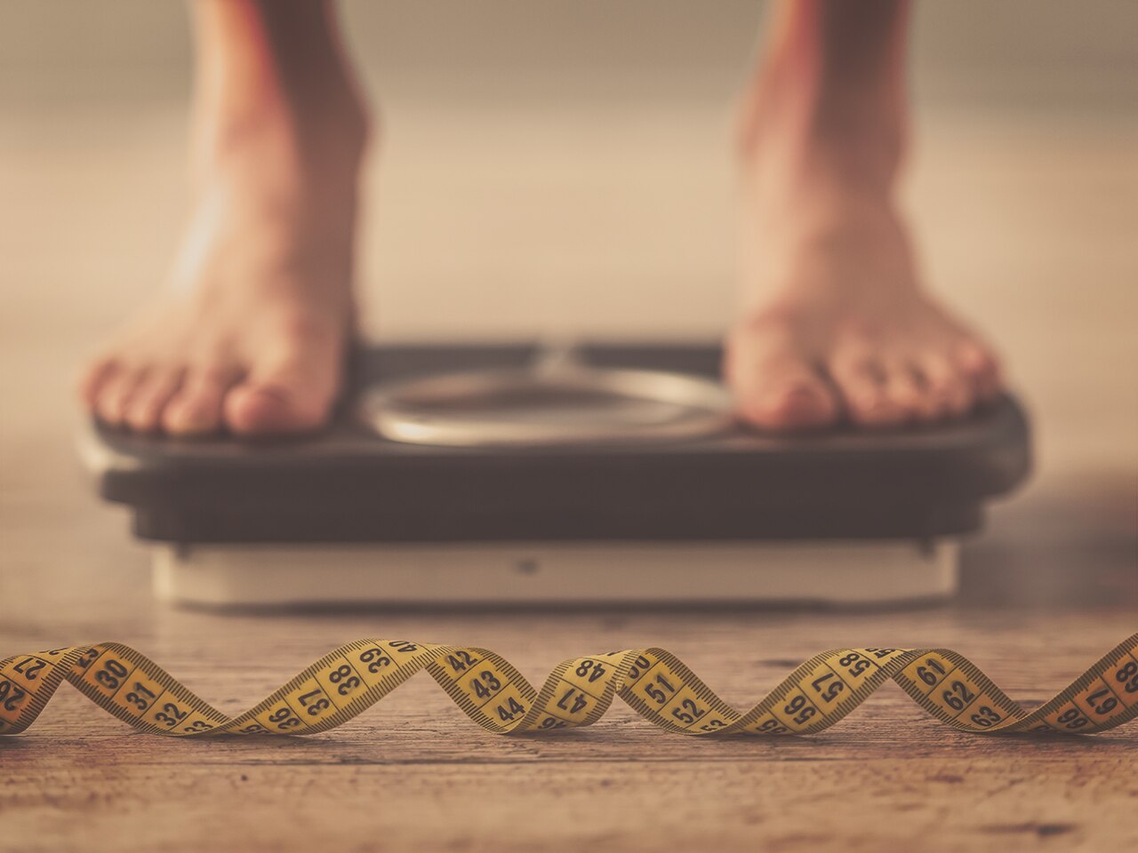 Woman standing on scales